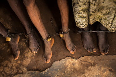 Chains shackling the ankles of patients being treated for mental health issues at Oke Oloro where the use of chains to restrain people is common practice. Traditional healer Sheu Saliu Ibrahim, who ru...