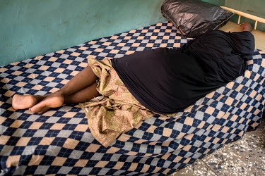 A patient lies on a foam mattress at the Dawanau Psychiatric Hospital, one of the few state-run mental health facilities where admission is free. It is the only Psychiatric Hospital hospital in Kano S...