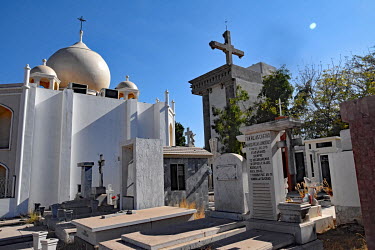 The Jardines de Humaya, a cemetery where many drug barons are buried. Even in death they try to outdo each other with pompous mausoleum architecture, some even three stories high.