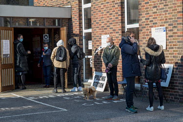 Door staff control the queue of people outside a polling station during voting for the London Mayor and other local offices on 6 May 2021. The current mayor, Sadiq Khan, held on to his office in a win...