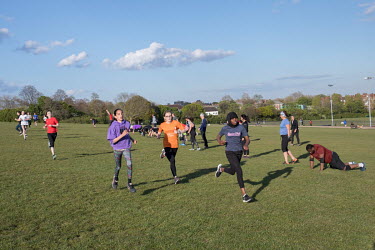 Outdoor exercise classes held on Hampstead Heath. Because of COVID-19 many indoor gyms in England have been forced to close. They hope to reopen as the UK vaccination program becomes more widespread a...