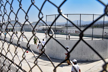 Inmates playing football in a prison in the state capital Morelia.