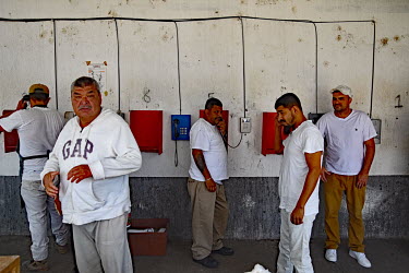Inmates making phone calls in a prison in the state capital Morelia.