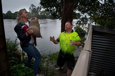 People try to build flood defences in Windsor where over the previous weekend, the Hawkesbury River rose rapidly by more than 30 feet.