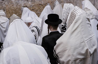 Orthodox Jews praying at the Wailing Wall during Passover.