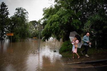 People take pictures of the flooded streets in Windor where over the previous weekend, the Hawkesbury River rose rapidly by more than 30 feet.