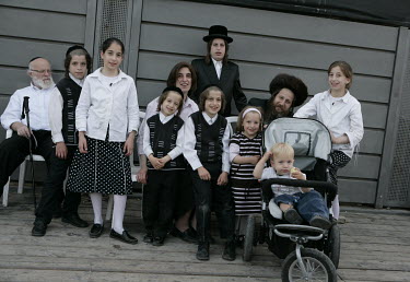 A family of Orthodox Jews gather to celebrate Passover.