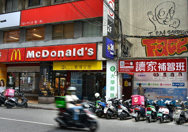 Graffiti beside a McDonald's restaurant in central Taipei declares 'I eat grabage'.