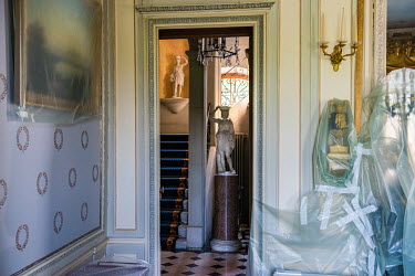Paintings and other items covered in plastic sheeting at Villa La Grange in Parc de La Grange, the location for the Biden - Putin summit. The site is being prepared with officials, technicians, restor...