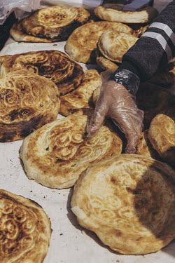 Traditional Kyrgyzstan bread (known as lepyoshka or tokach) is sold to spectators at the World Nomad Games.