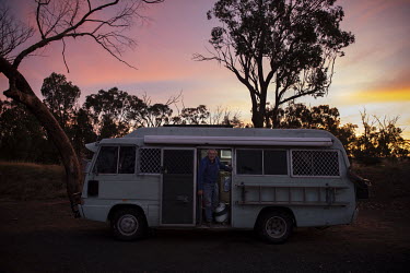 Barney Webb gets out of his van parked for the night in a truck stop on the outskirts of Dubbo. The region has been inundated with mice. Barney has had to make several traps in his van where he curren...