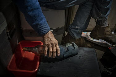 Barney Webb prepares a mouse trap in his van parked for the night in a truck stop on the outskirts of Dubbo. The region has been inundated with mice. Barney has had to make several traps in his van wh...