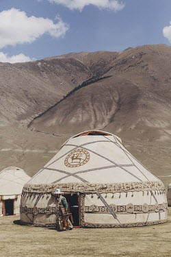 A Kyrgyz man exits a yurt (tent) at the 'Ethno-Village' at the World Nomad Games.