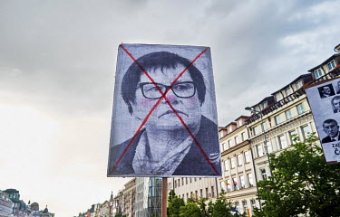 A protester holds a placard with a photo of Czech Justice Minister Marie Benesova during a demonstration on Wenceslas' Square where thousands of Czechs expressed their concerns about the independence...