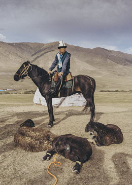 Sheep are prepared for slaughter in advance of a much anticipated Kok-Boru match for spectators at the World Nomad Games.