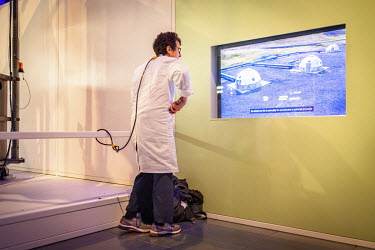 A scientist chained to a display at the 'Our Future Planet' exhibition at the Science Museum in South Kensington. The scientists are protesting Shell's sponsoring of the exhibition which advocates tec...