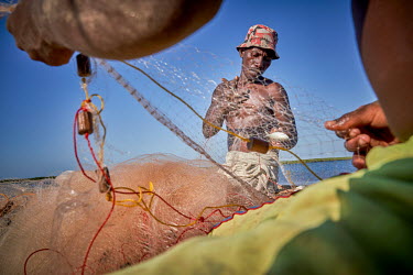 Fishermen prepare their nets in Beanjavilo, a village set among mangroves in the western coastal region.