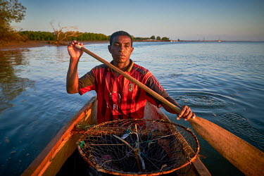 A fishermen paddles his canoe in Beanjavilo, a village set among mangroves in the western coastal region.