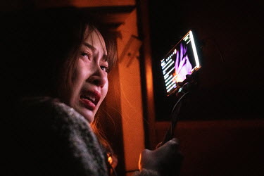 Nai Nai, a 23-year-old live-streamer screams to her camera during a visit to a haunted house. Nai Nai's fans are mostly Chinese men between 15 and 30 years old who post messages and virtual gifts, vis...
