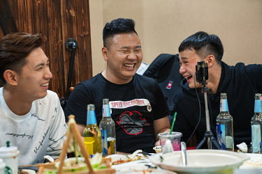 Old Metal (centre), a 26-year-old live-streams with Jiang Bo (left), and a fan (right). Nai Nai's fans are mostly Chinese men between 15 and 30 years old who post messages and virtual gifts, visible t...