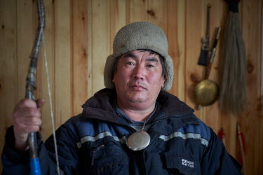 Shaman, Kim Pomishin, in a Buryati village in Selenga on the shore of Lake Baikal.   Crowned the 'Jewel of Siberia', Lake Baikal is the world's deepest lake, and the biggest lake by volume, holding 20...