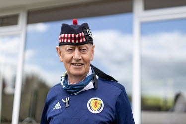 Alan Paterson, a member of the 'Tartan Army', the name for fans of Scotland's national football team, dressed in a a Scottish football team jersey.
