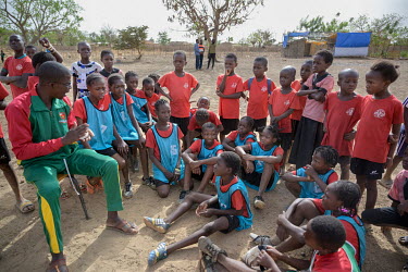 A football coach talks to players during a match at the Denro de Koudougou association which offers a mixed sport-study football course from primary school onwards. The first in West Africa, and proba...