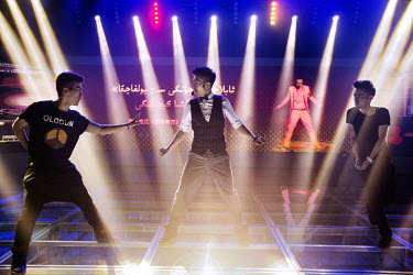 Uighur pop sensation Ablajan (centre) on stage during rehearsals with his dancers for a planned live webcast concert scheduled for that afternoon. However, the performance, to be held at a state owned...
