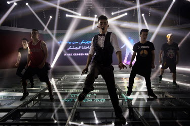 Uighur pop sensation Ablajan (centre) on stage during rehearsals with his dancers for a planned live webcast concert scheduled for that afternoon. However, the performance, to be held at a state owned...