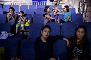 Performers and crew of Uighur pop sensation Ablajan watch rehearsals for a planned live webcast concert scheduled for that afternoon. However, the performance, to be held at a state owned broadcasting...