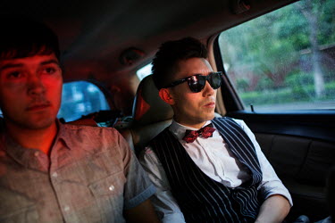 Uighur pop sensation Ablajan (right) appears disappointed as he and his assistant are driven home following the cancellation of a planned live webcast concert scheduled for earlier that afternoon. The...