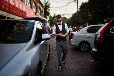 Uighur pop sensation Ablajan appears dissapointed as he walks to his studio following the cancellation of a planned live webcast concert scheduled for that afternoon. The performance, to be held at a...