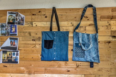 Tote bags made out of discarded poor quality second-hand clothing, on display in a studio where Yayra Agbofah, a creative social entrepreneur, and Boison Kwamena, a fashion enthusiast, and co-founders...