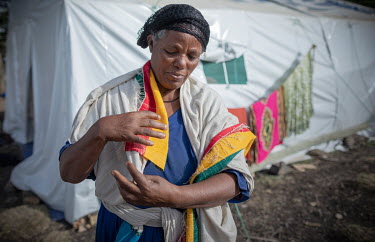 Yeshamie Destage, wearing her locally made shawl in the colours of the Ethiopian national flag, in a camp of internally displaced people following an armed attack on the town of Ataye destroyed more t...
