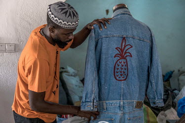 Boison Kwamena, a fashion enthusiast, and co-founder of The Revival an up-cycling outfit in Accra, works with discarded poor quality second-hand clothing to repurpose to produce functional designs and...