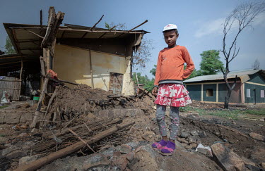 A young girl standing among the rubble of her family's destroyed home. An armed attack on the town of Ataye destroyed more than 1500 buildings and killed at least 100 people. Athough the Oromo Liberat...