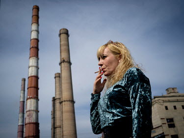 Natalia Voronkova, a volunteer who offers support and basic first aid training for Ukrainian government forces fighting Russian-backed separatists in the east of the country. She is smoking while on a...