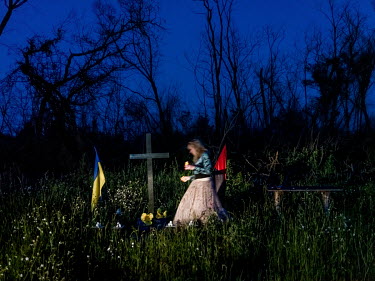 Natalia Voronkova, a volunteer who offers support and basic first aid training for Ukrainian government forces fighting Russian-backed separatists in the east of the country, visits the memorial site...