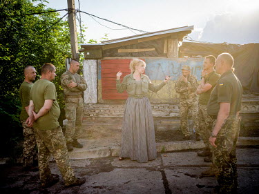 Natalia Voronkova, a volunteer who offers support and basic first aid training for Ukrainian government forces fighting Russian-backed separatists in the east of the country, gathers a group of soldie...