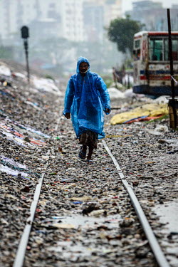 A man walks through the rain.  Water is essential for survival, yet in Bangladesh water also has the power to destroy anything in its path. For months at a time, monsoon season brings heavy rainfall t...