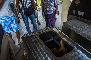 Family and friends carry the casket as they claim from the morgue the dead body of Wai Phyo Thu, a protestor who was shot and killed in South Dagon the previous day when the security forces fired on p...