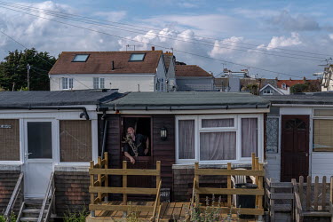 A local resident with his cat near the beach front in Bognor Regis.