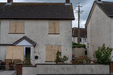Houses boarded up to protect them from the heat generated by the town's Orangeman's Day bonfire.