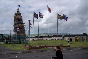 The main bonfire in the town of Larne. On the top flies a Republican Starry Plough Flag along with a Brexit sign and an IRA sign.