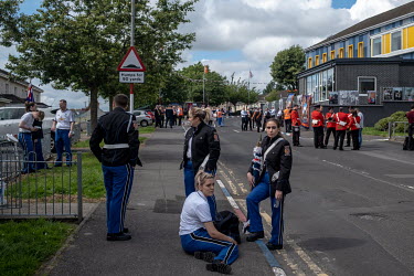Band members gather in the Loyalist Fountain Estate for parades celebrating the 12th July and the defeat of the Catholic Army at the Battle of the Boyne in 1690.