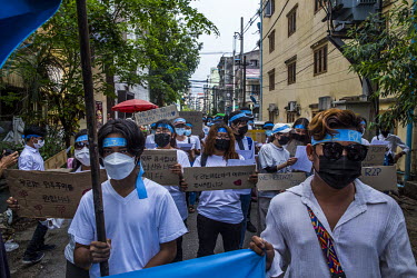 In a flashmob protest against the military coup, youth demonstrators wear headbands with the slogan 'R2P' (Responsbility to Protect) and hold signs thanking other countries who have shown support towa...