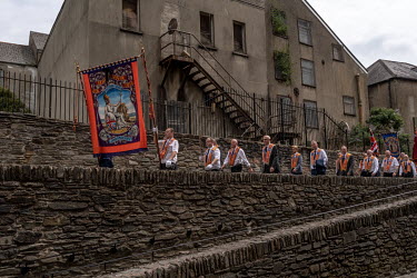 Orangemen parade along the walls of the City of Derry/Londonderry.