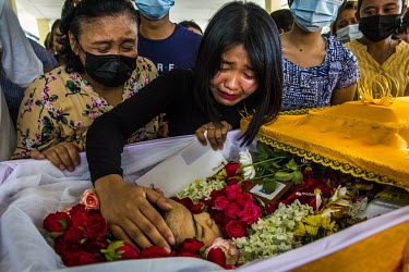 The family mourns at the funeral of Ma Khine Zar Thwe (25), a bank worker, who was shot and killed on 28 March 2021 amid a protest crackdown in South Dagon township, at her funeral.