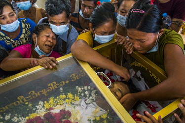 Family members including the mother, the wife and siblings, mourn at the funeral of a protestor Ko Aung Ko Oo (29), who was shot and killed when the security forces fired on protestors and civilians a...