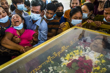 Family members including the mother, the wife and siblings, mourn at the funeral of a protestor Ko Aung Ko Oo (29), who was shot and killed when the security forces fired on protestors and civilians a...